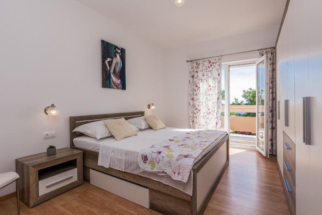 Posteľ alebo postele v izbe v ubytovaní Apartments Hidden Beach Gem