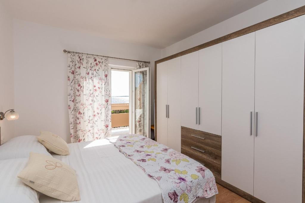 Posteľ alebo postele v izbe v ubytovaní Apartments Hidden Beach Gem