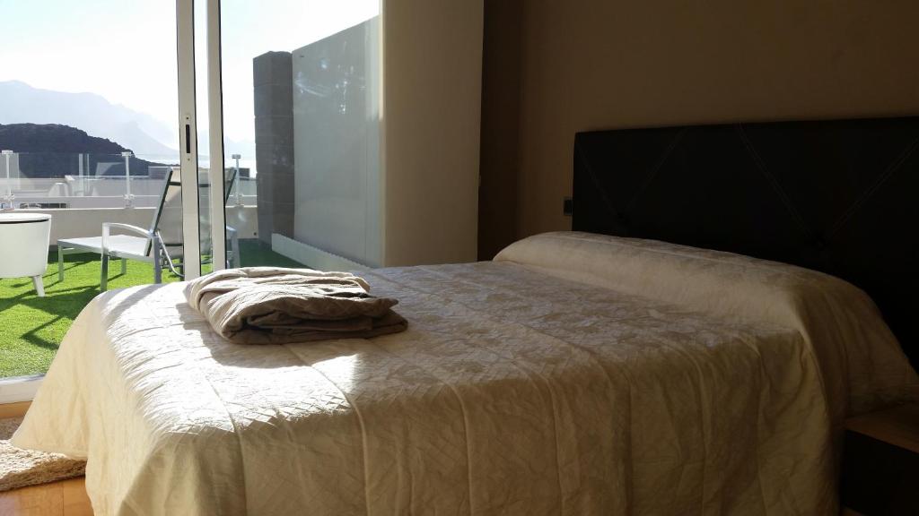 Postel nebo postele na pokoji v ubytování Él Rome Duplex