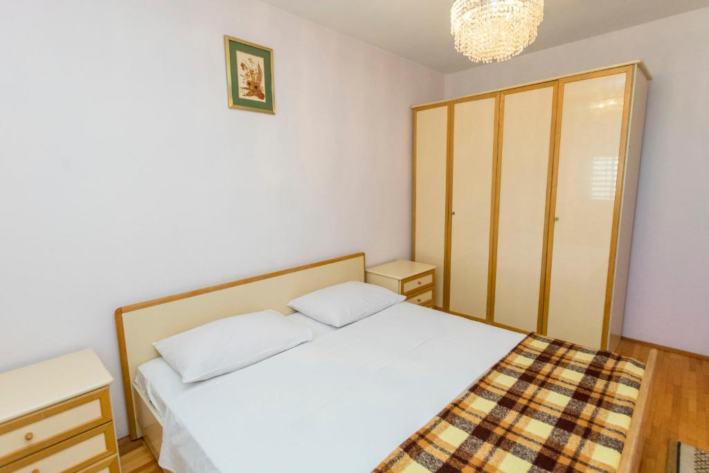 Postel nebo postele na pokoji v ubytování Apartment Smiljan