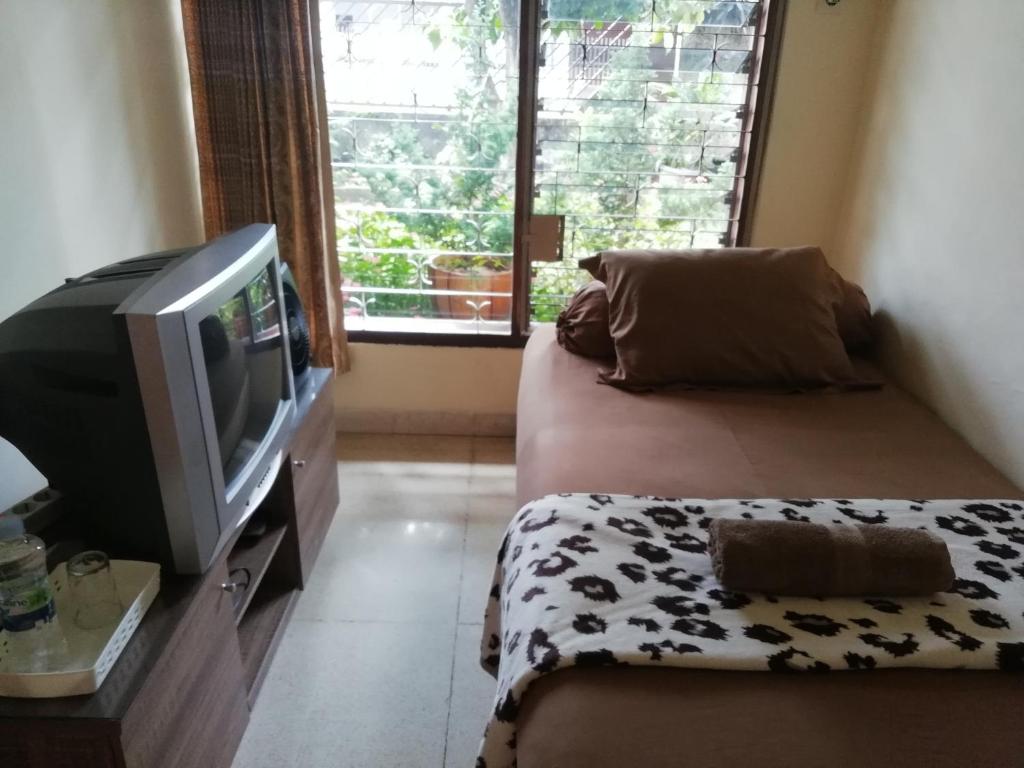 Televiisor ja/või meelelahutuskeskus majutusasutuses GIO Guesthouse Bogor