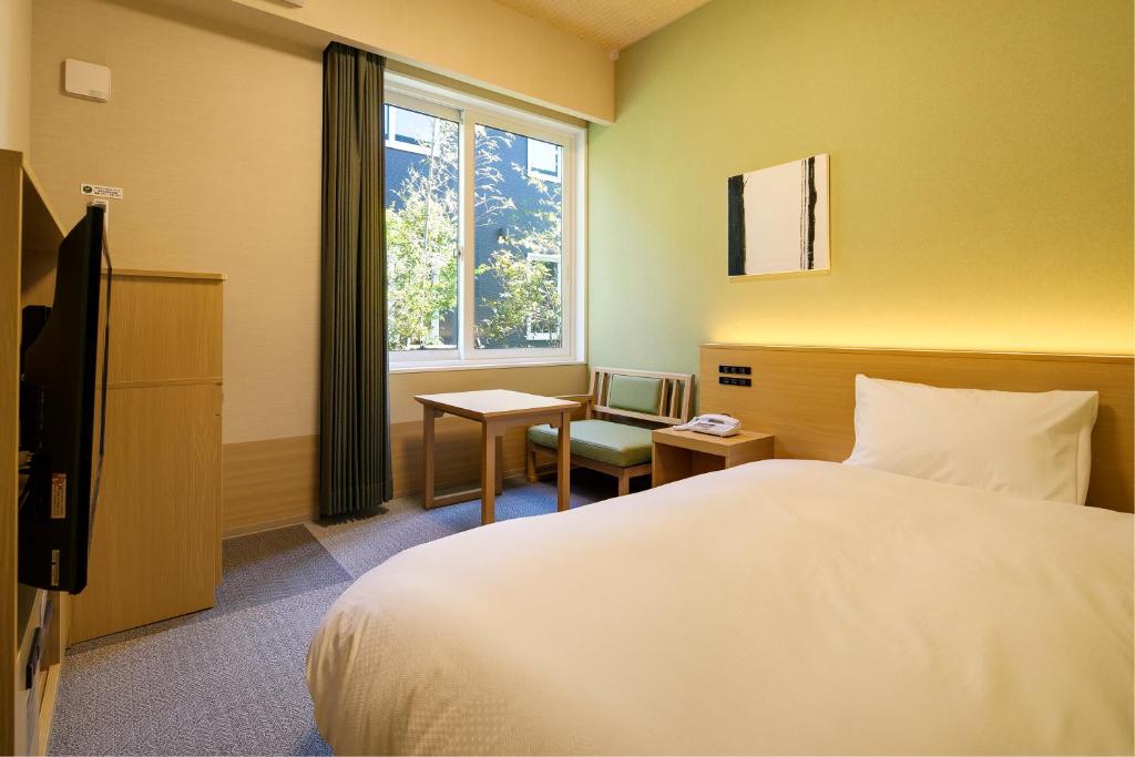Postel nebo postele na pokoji v ubytování GRANDVRIO HOTEL NARA -WAKURA- -ROUTE INN HOTELS-