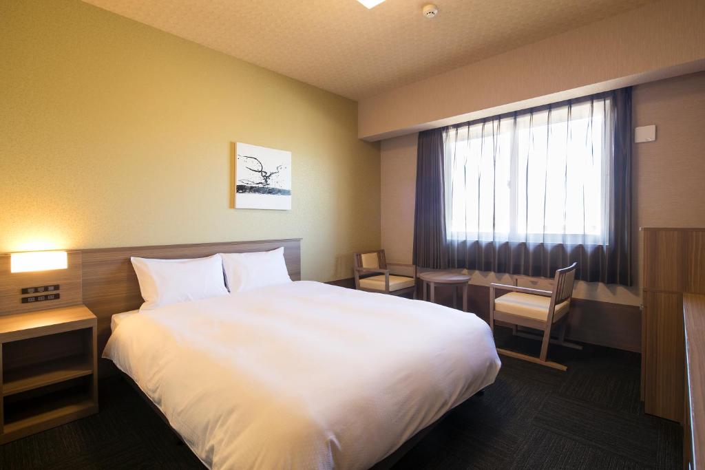 Postel nebo postele na pokoji v ubytování GRANDVRIO HOTEL NARA -WAKURA- -ROUTE INN HOTELS-
