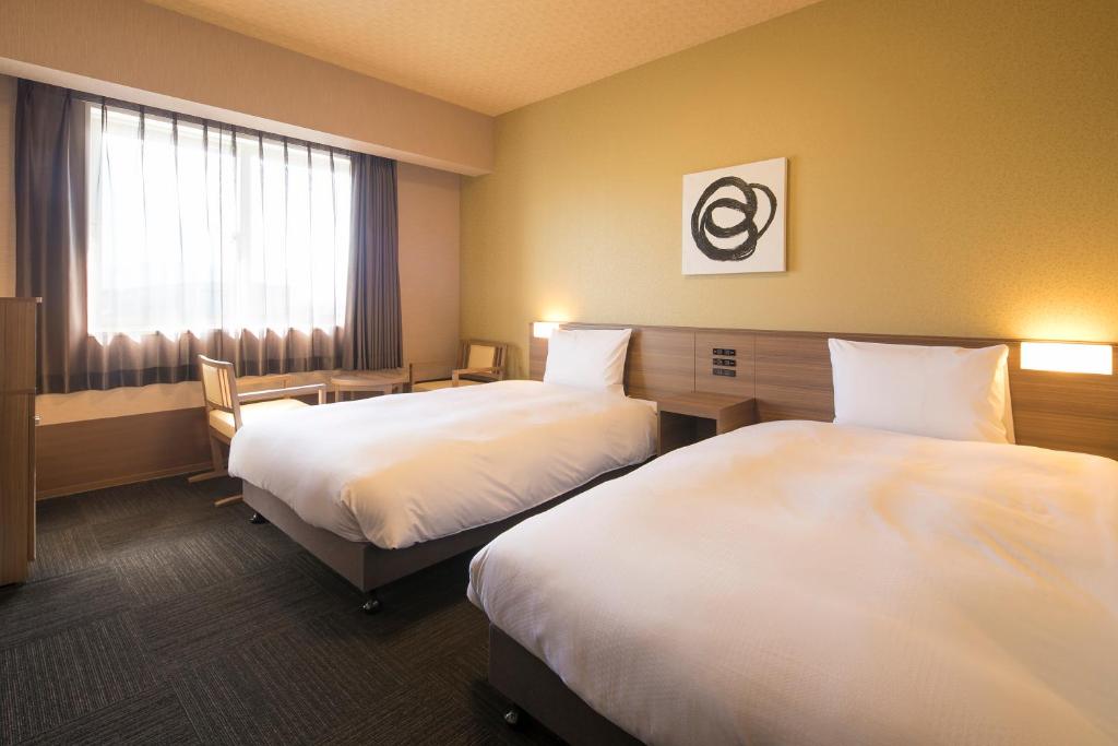 Postel nebo postele na pokoji v ubytování GRANDVRIO HOTEL NARA -WAKURA- -ROUTE INN HOTELS-