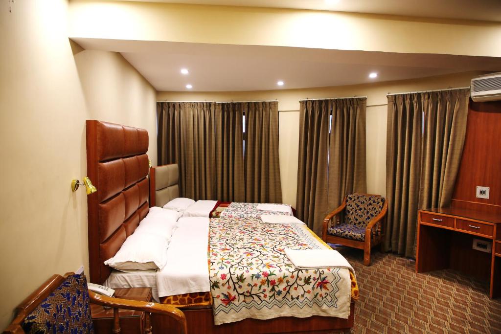 Postel nebo postele na pokoji v ubytování Hotel Centre Point