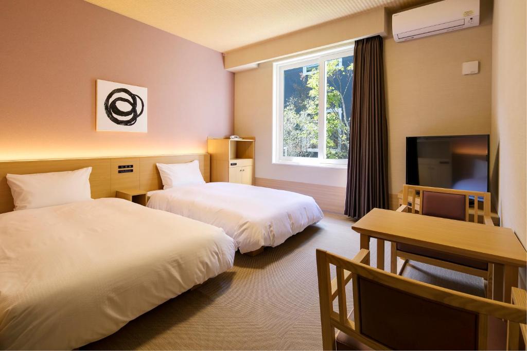Postel nebo postele na pokoji v ubytování GRANDVRIO HOTEL NARA -WAKURA- -ROUTE INN HOTELS-