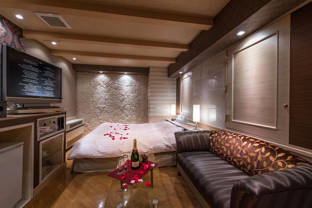Postel nebo postele na pokoji v ubytování Hotel Moana Shinjuku (Adult Only)