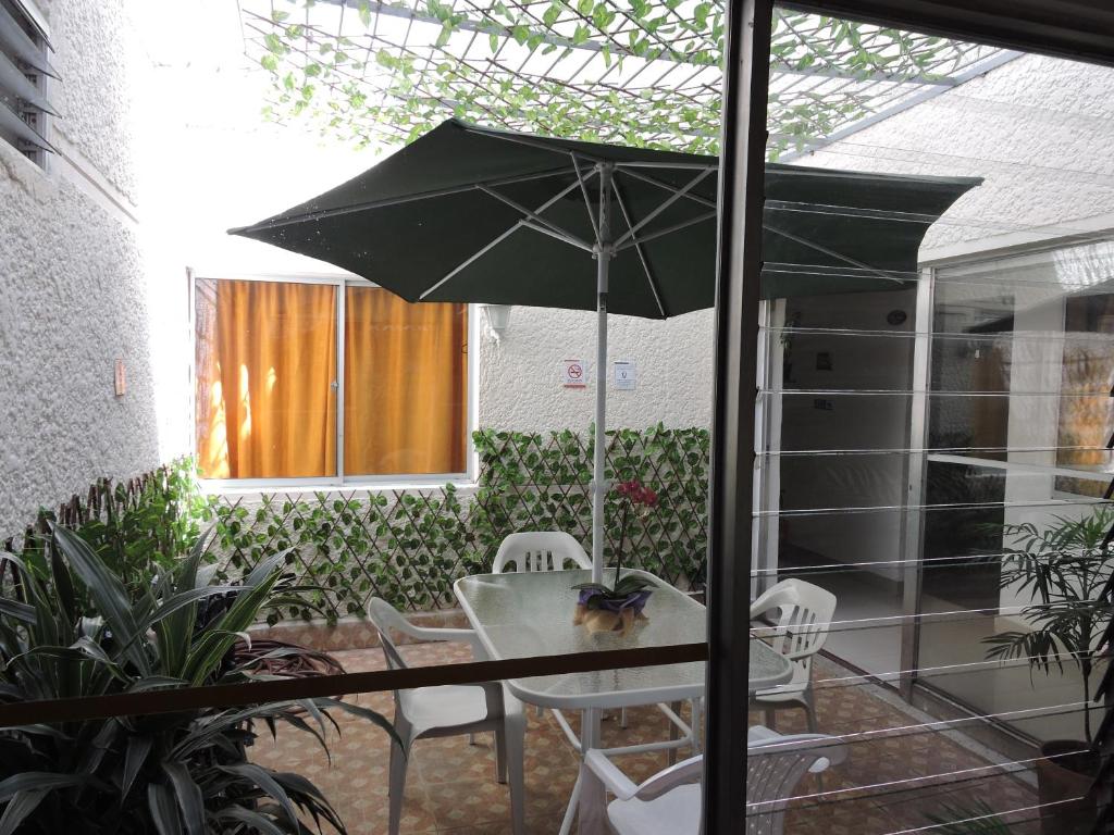 Patio nebo venkovní prostory v ubytování hotel medellin calasanz