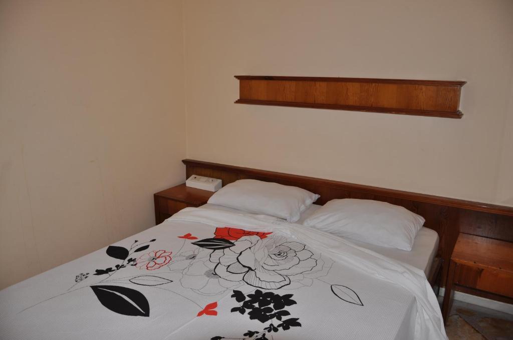 Postel nebo postele na pokoji v ubytování Tuncer Garden Hotel