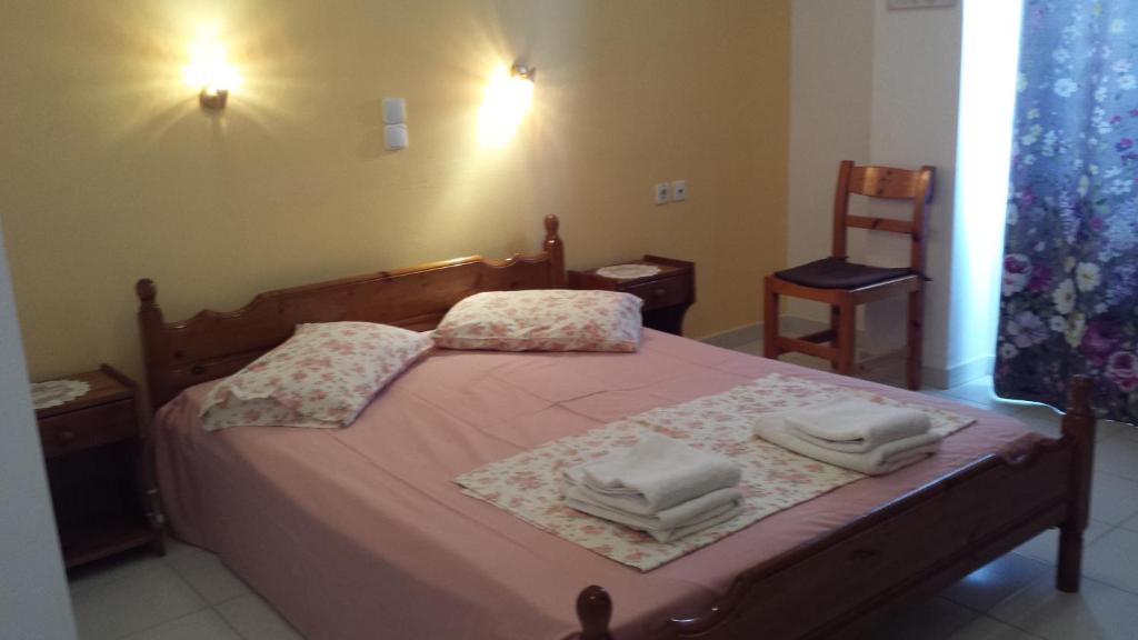 Postel nebo postele na pokoji v ubytování Eva Apartments