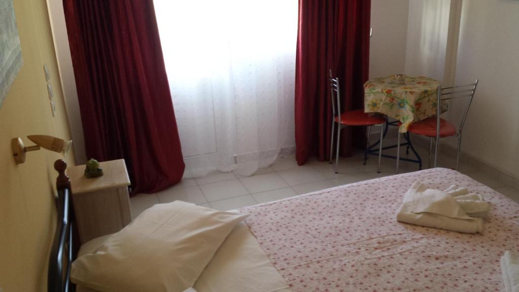 Postel nebo postele na pokoji v ubytování Eva Apartments