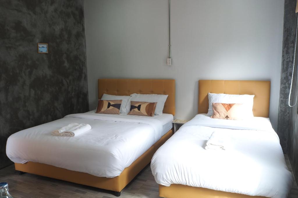 Postel nebo postele na pokoji v ubytování บ้านแก่งรีสอร์ท เชียงคาน