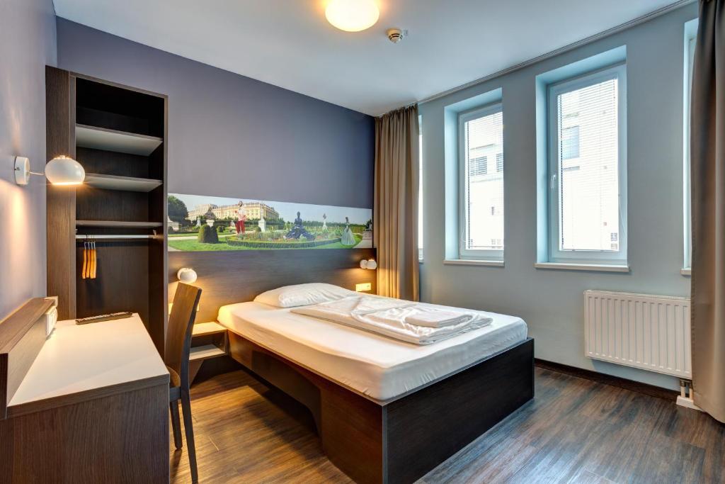 Postel nebo postele na pokoji v ubytování MEININGER Hotel Wien Downtown Sissi