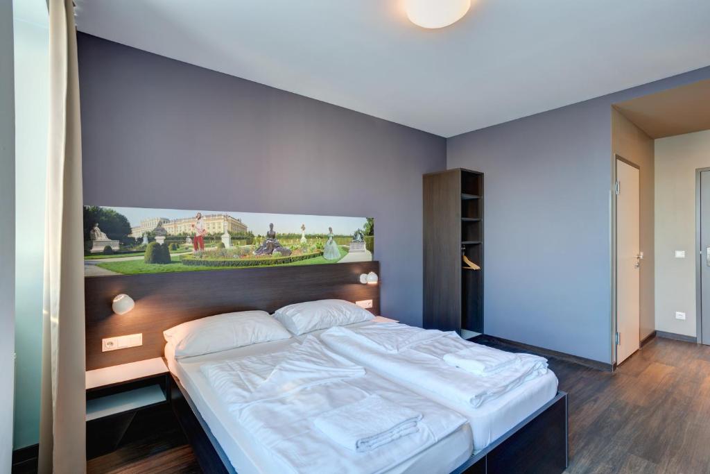 Postel nebo postele na pokoji v ubytování MEININGER Hotel Wien Downtown Sissi