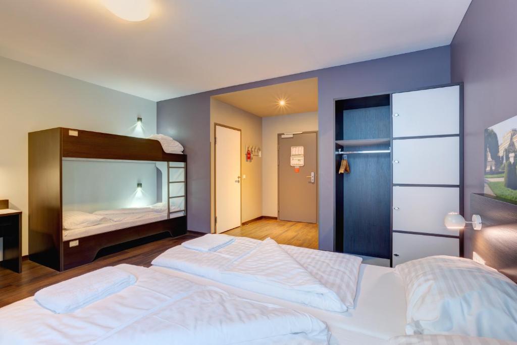 Postel nebo postele na pokoji v ubytování MEININGER Hotel Wien Downtown Sissi