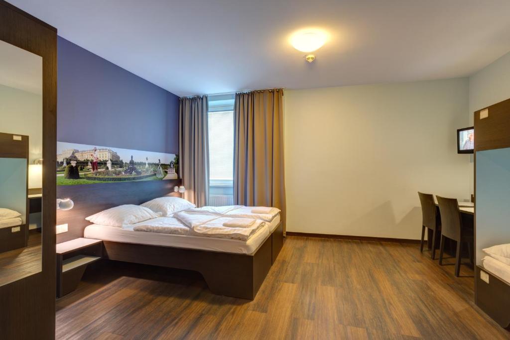 Postel nebo postele na pokoji v ubytování MEININGER Hotel Wien Downtown Sissi