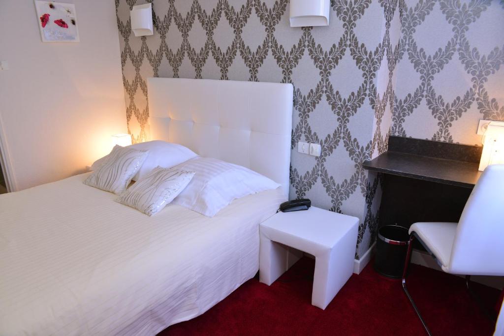 Postel nebo postele na pokoji v ubytování Hôtel Le Square