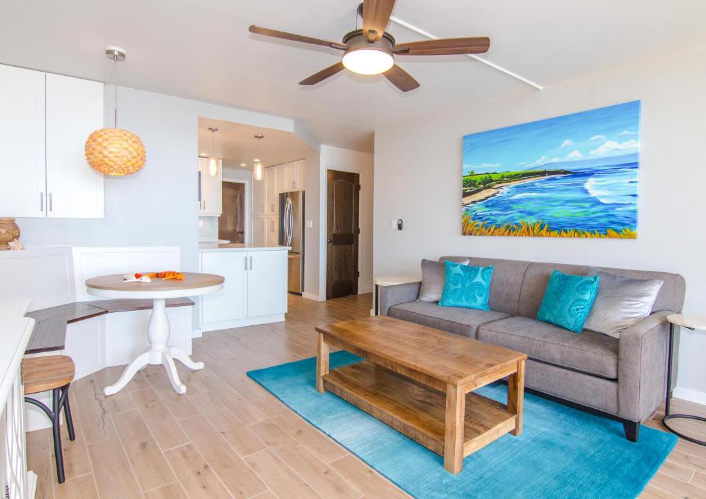 a living room with a couch and a table at Island Sands 505 in Maalaea