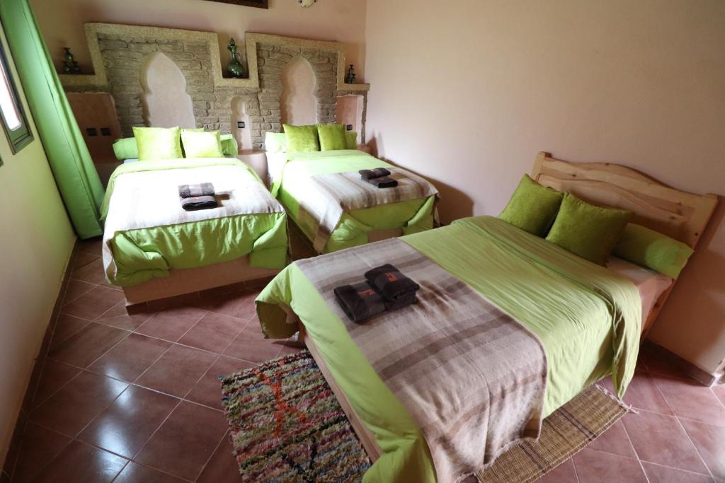 Ein Bett oder Betten in einem Zimmer der Unterkunft Riad Moha