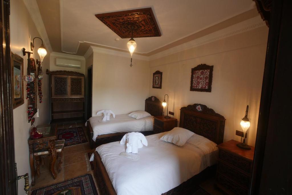 Ένα ή περισσότερα κρεβάτια σε δωμάτιο στο Nilya Hotel