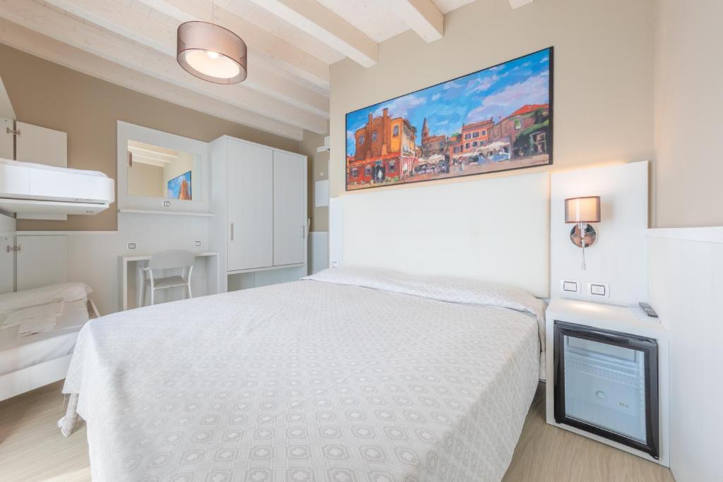 Postel nebo postele na pokoji v ubytování Hotel Garni' Serena