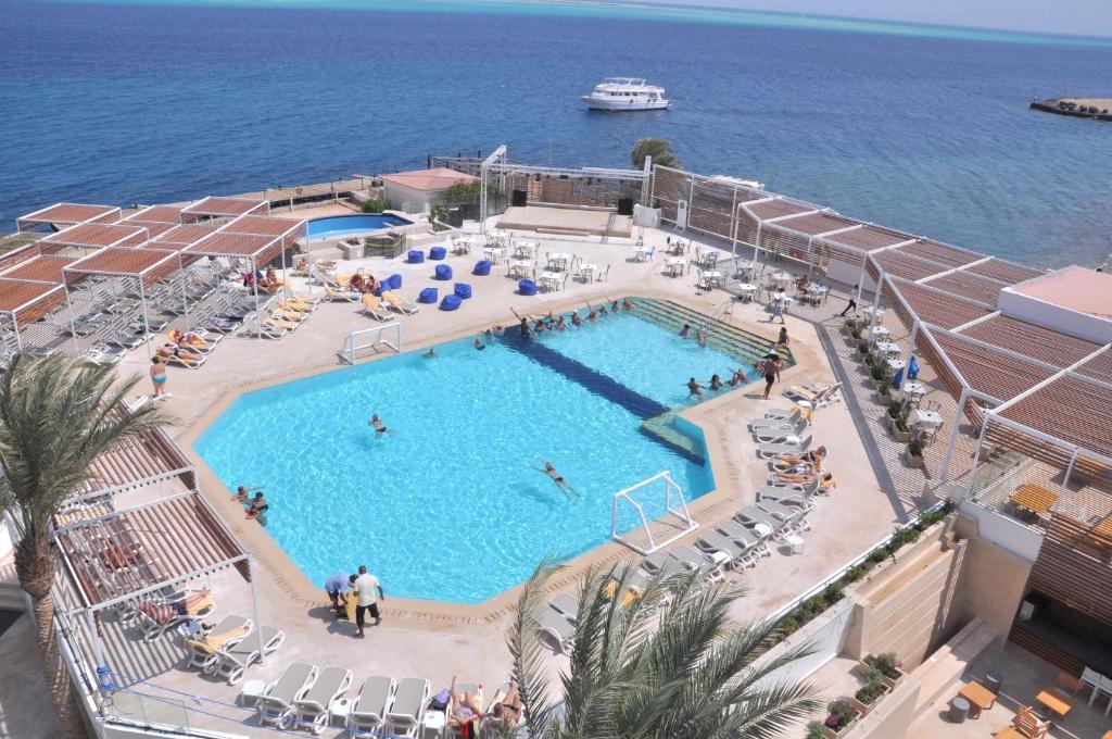 a swimming pool on a cruise ship next to the ocean at Sunrise Holidays Resort -Adults Only in Hurghada