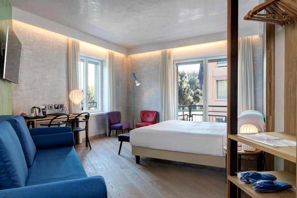 Postel nebo postele na pokoji v ubytování Hotel Firenze
