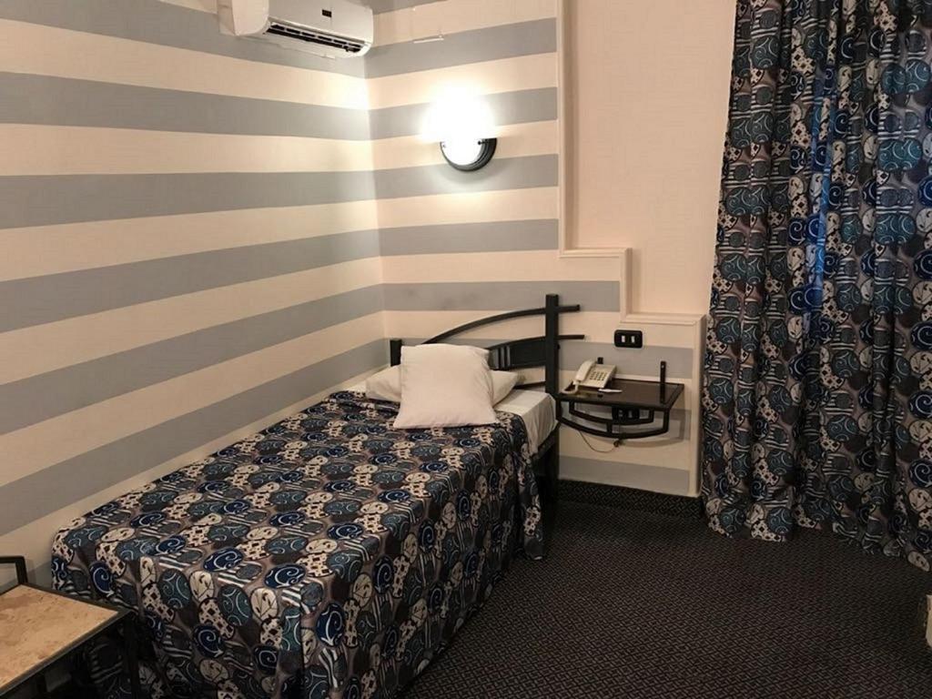 Postel nebo postele na pokoji v ubytování Havana Hotel Cairo
