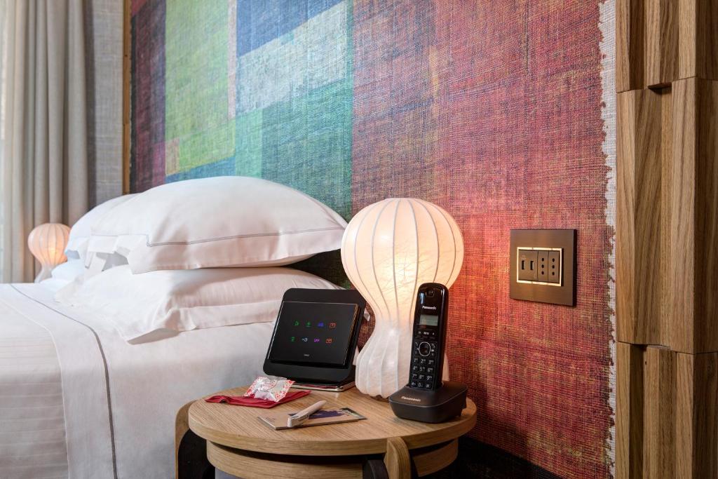 Postel nebo postele na pokoji v ubytování Hotel Firenze