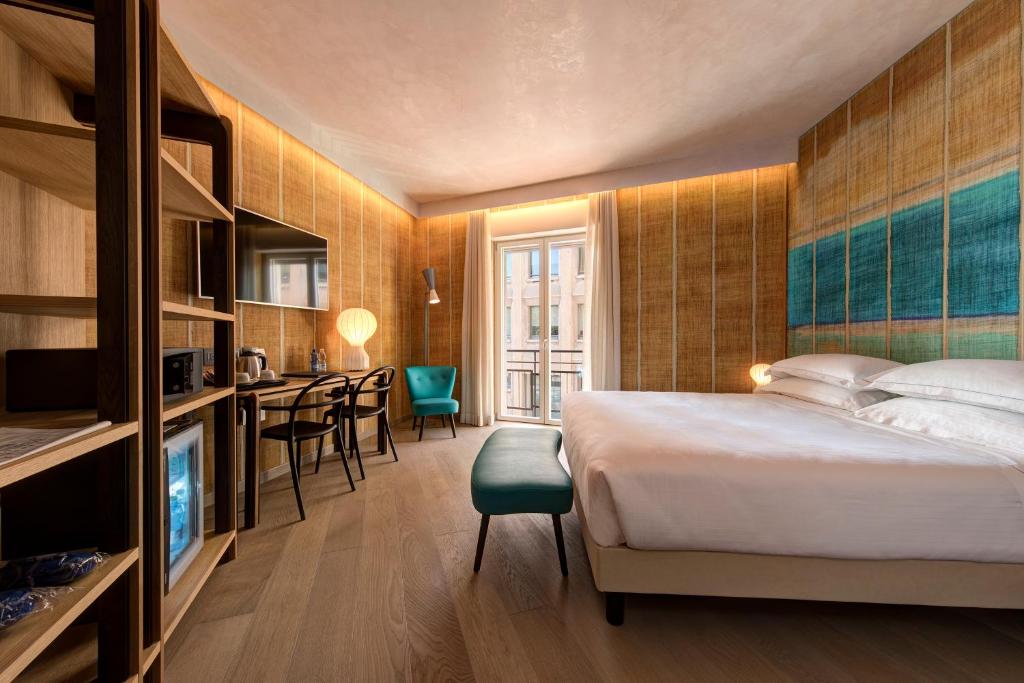 Postel nebo postele na pokoji v ubytování Hotel Firenze