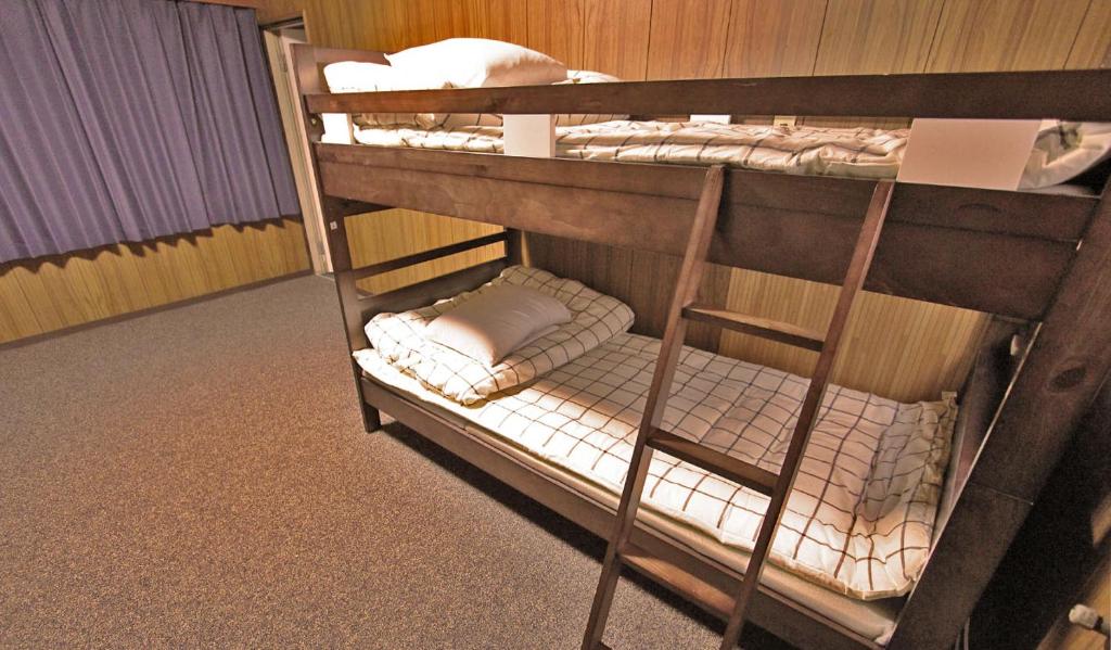 Postel nebo postele na pokoji v ubytování Hibari House