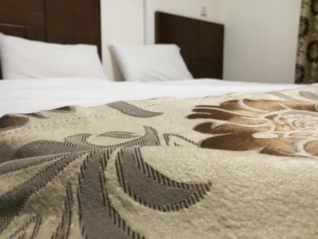 Postel nebo postele na pokoji v ubytování Darak hotel