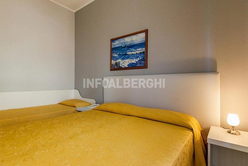 Postel nebo postele na pokoji v ubytování Hotel Antonella