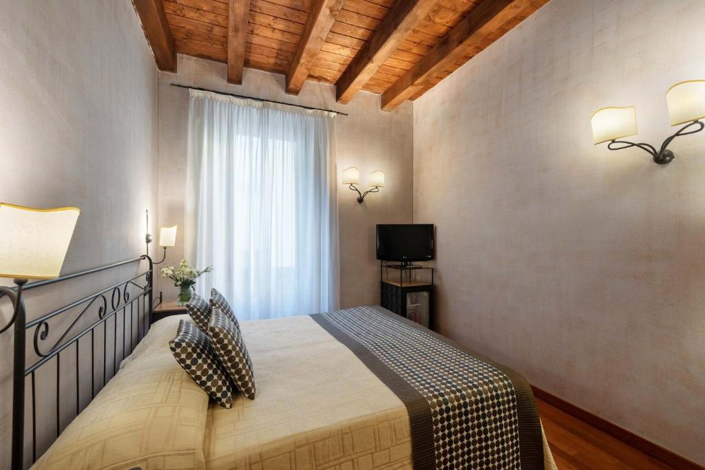 Postel nebo postele na pokoji v ubytování Hotel Marco Polo