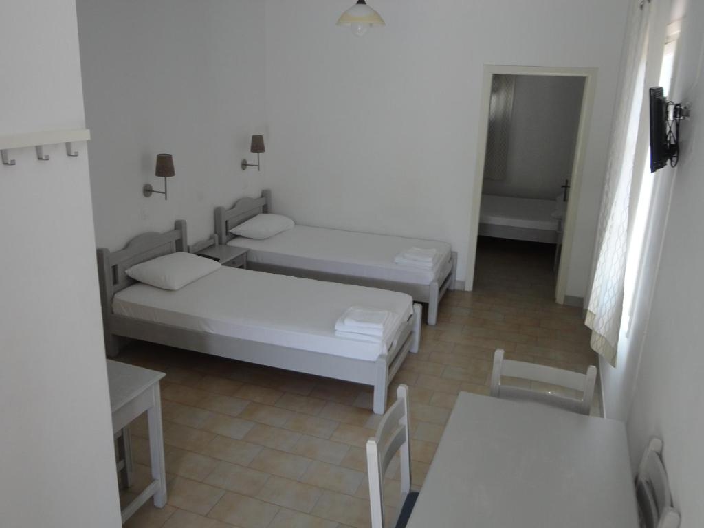 Postel nebo postele na pokoji v ubytování Lianos Hotel Apartments
