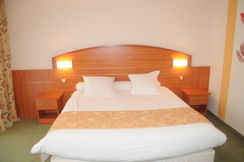 Postel nebo postele na pokoji v ubytování Hotel Cigoland