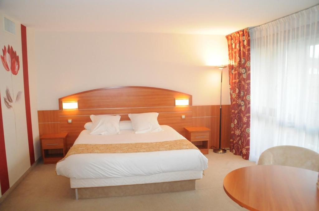 Postel nebo postele na pokoji v ubytování Hotel Cigoland