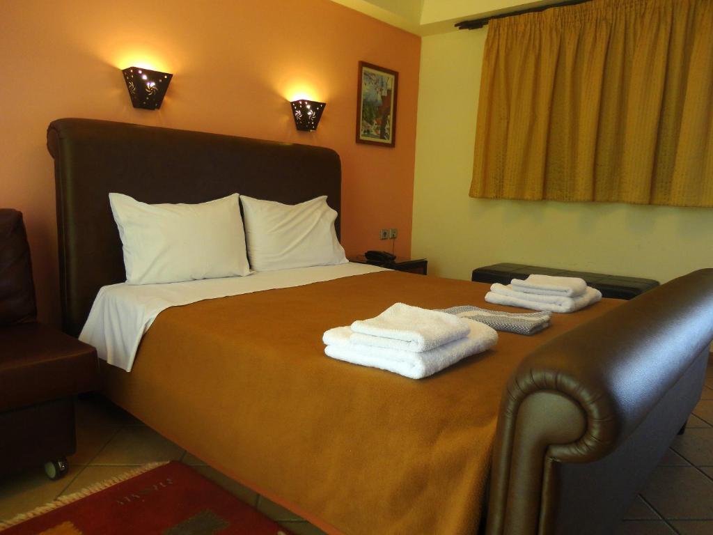 Łóżko lub łóżka w pokoju w obiekcie Lirio Guest House