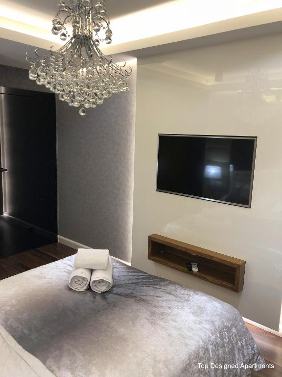 Posteľ alebo postele v izbe v ubytovaní Top Designed Apartments