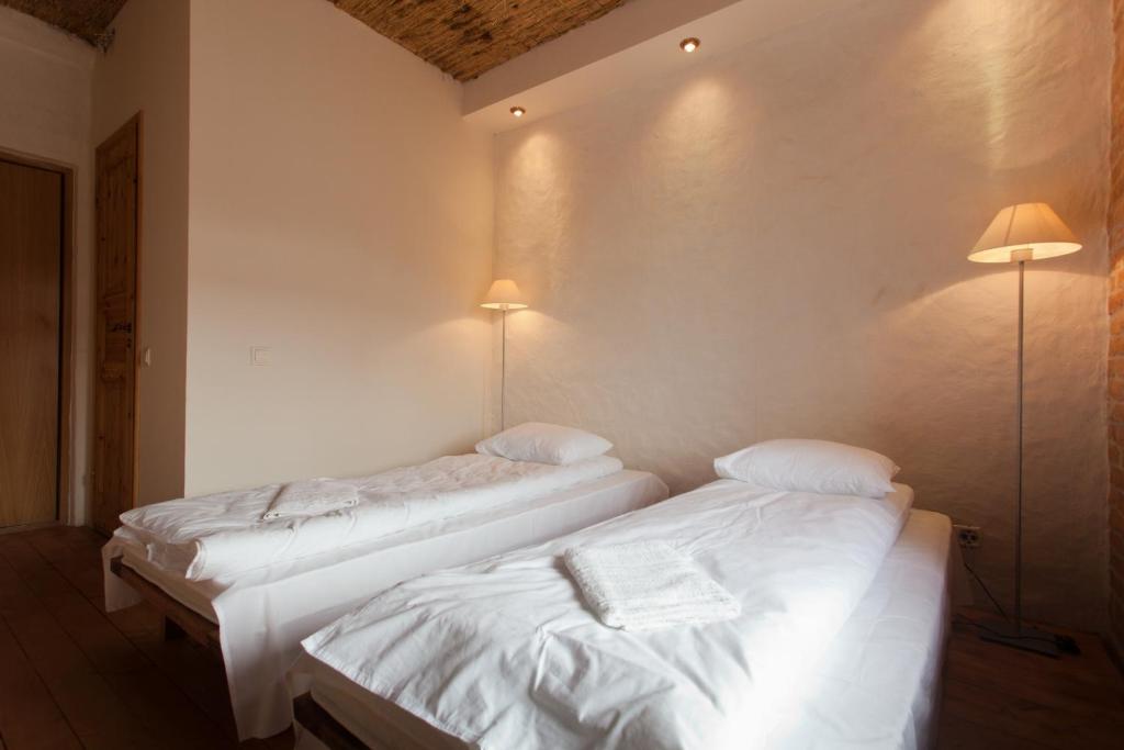 Voodi või voodid majutusasutuse Beguta Guest House toas