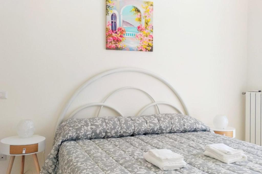 A bed or beds in a room at Il Soffione Home