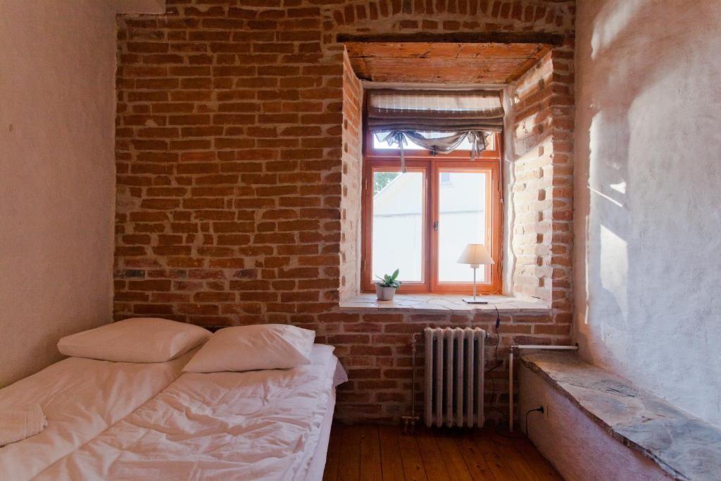 Voodi või voodid majutusasutuse Beguta Guest House toas