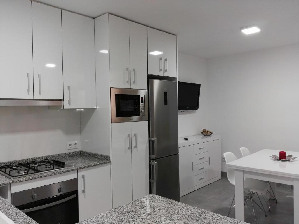 Kuchyň nebo kuchyňský kout v ubytování PRECIOSO APARTAMENTO EN PRIMERA LINEA DE MAR
