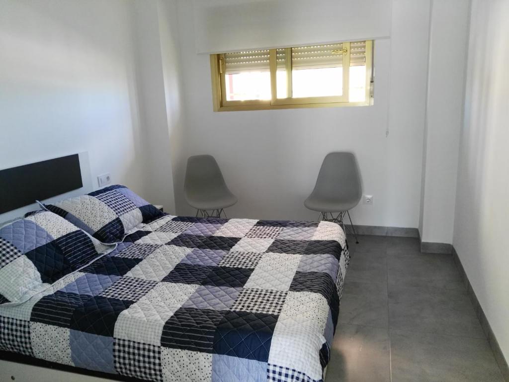 Postel nebo postele na pokoji v ubytování PRECIOSO APARTAMENTO EN PRIMERA LINEA DE MAR