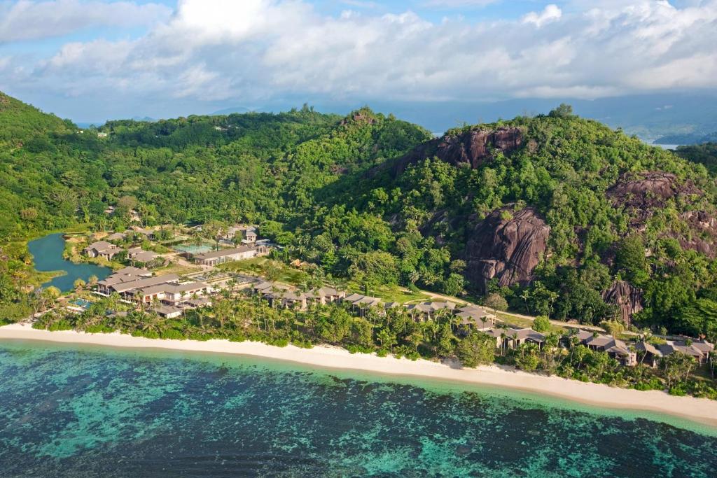 
a scenic view of a beach with a view of the ocean at Kempinski Seychelles Resort in Baie Lazare Mahé
