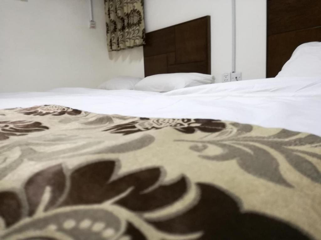 Postel nebo postele na pokoji v ubytování Darak hotel