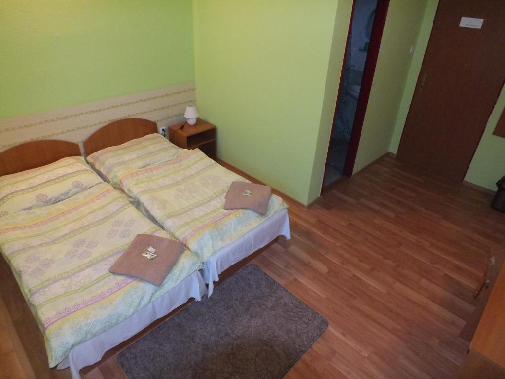 Posteľ alebo postele v izbe v ubytovaní FAN FAN PENZIÓN