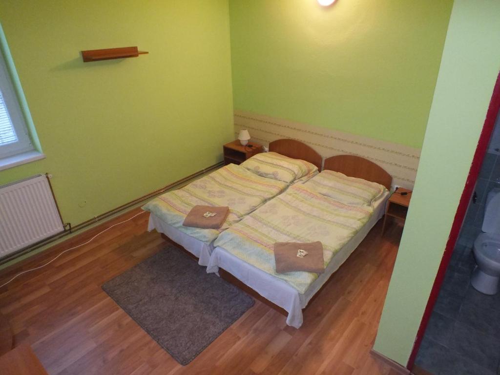 Posteľ alebo postele v izbe v ubytovaní FAN FAN PENZIÓN