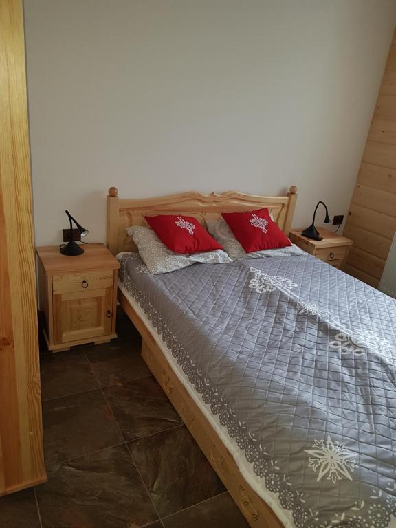 Posteľ alebo postele v izbe v ubytovaní Apartament Zielony