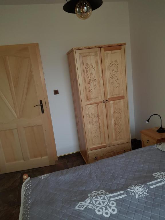 Posteľ alebo postele v izbe v ubytovaní Apartament Zielony